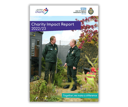 Impact report 22-23 front cover with two EEAST volunteers talking in the wellbeing garden